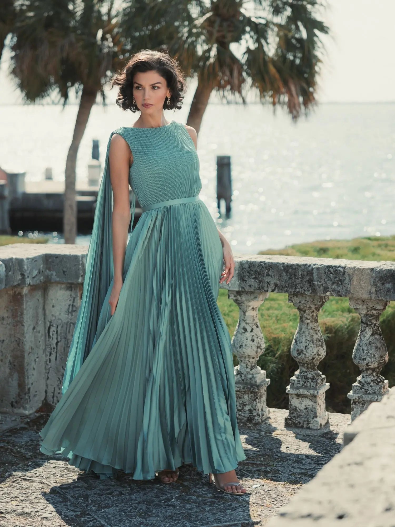 Green Sleeveless High Neck Cape Back Heat Pleated Gown