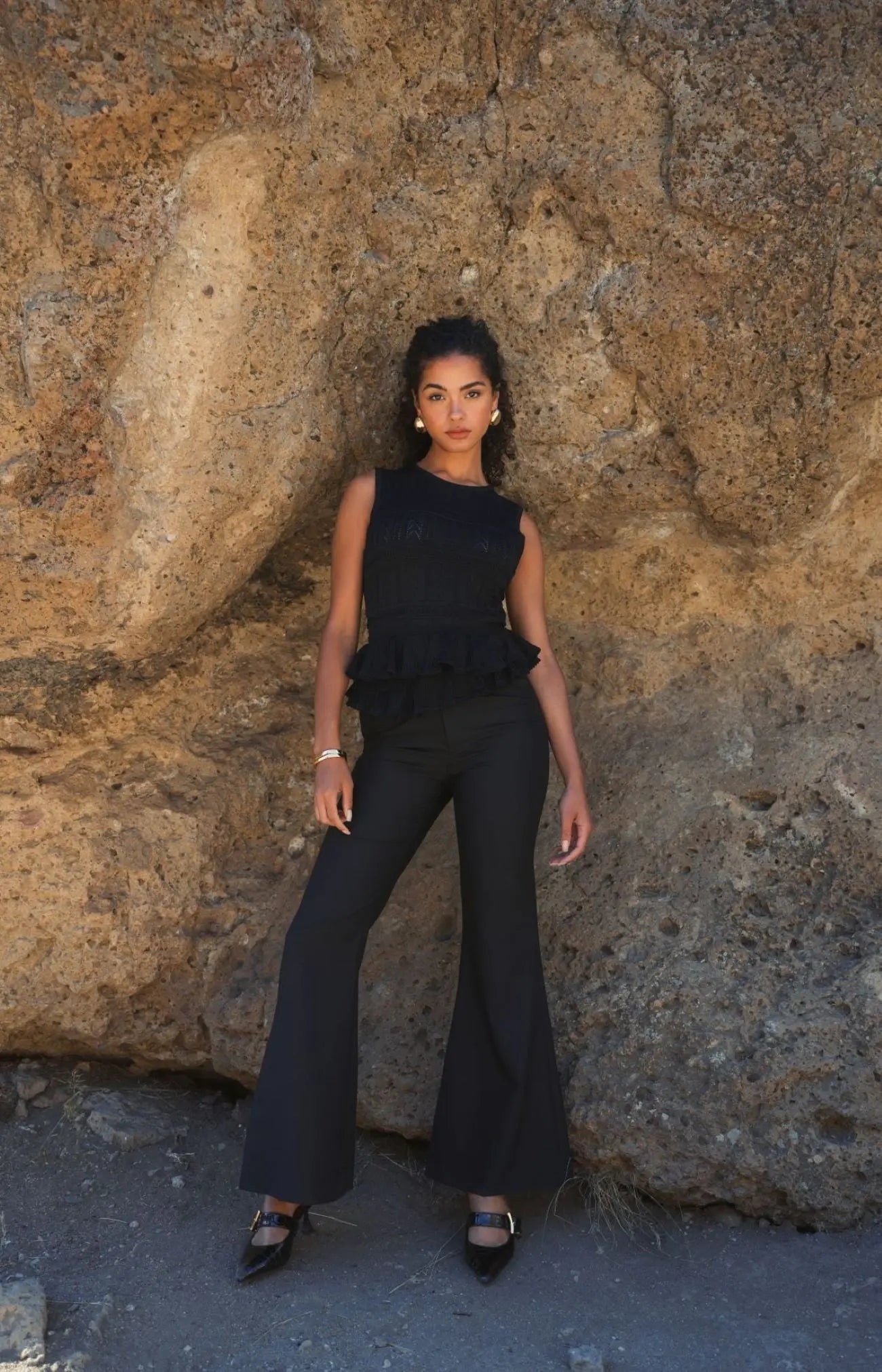 Black Sleeveless High Neck Knit Top With Ruffle Hem - FINAL SALE